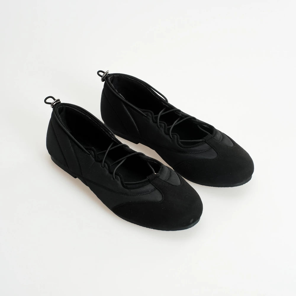 Pair of black flatshoes on a white background