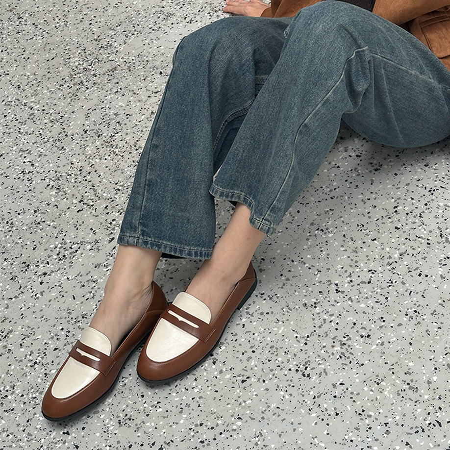 Women’s two-tone light brown and white flat shoes in elegant loafer style, made from premium vintage faux leather, perfect for both formal and casual looks.