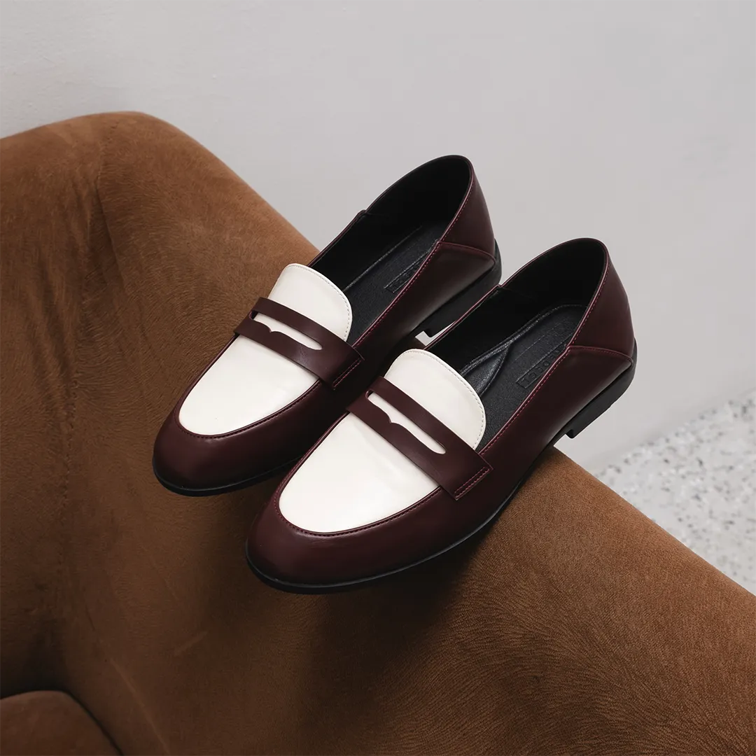 Women’s two-tone maroon and white flat shoes in elegant loafer style, made from premium vintage faux leather, perfect for both formal and casual looks.