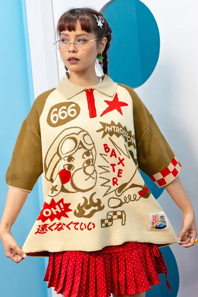 Person wearing a unique outfit with a graphic brown and beige top by oh.irv and red skirt against a blue and white background.