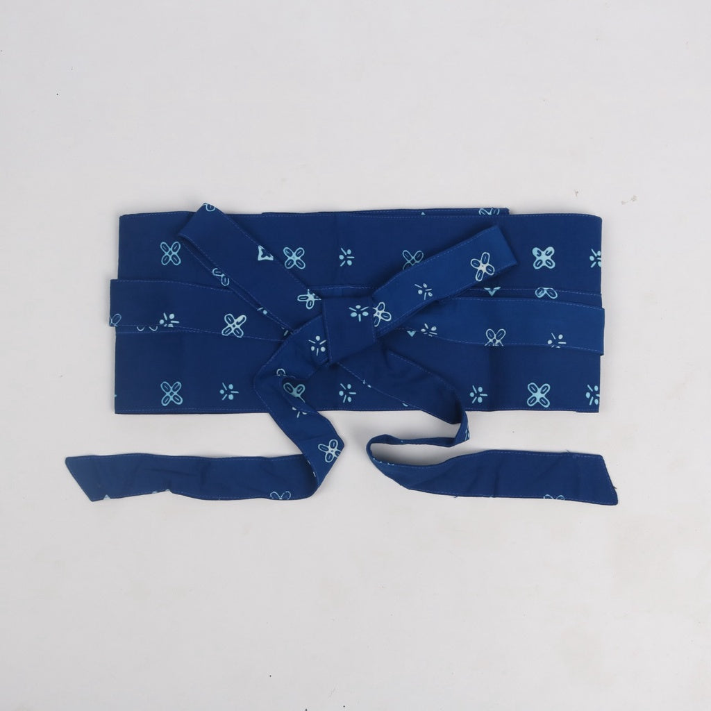 A blue obi belt with a floral pattern, presumably made of rayon, displayed on a white background.