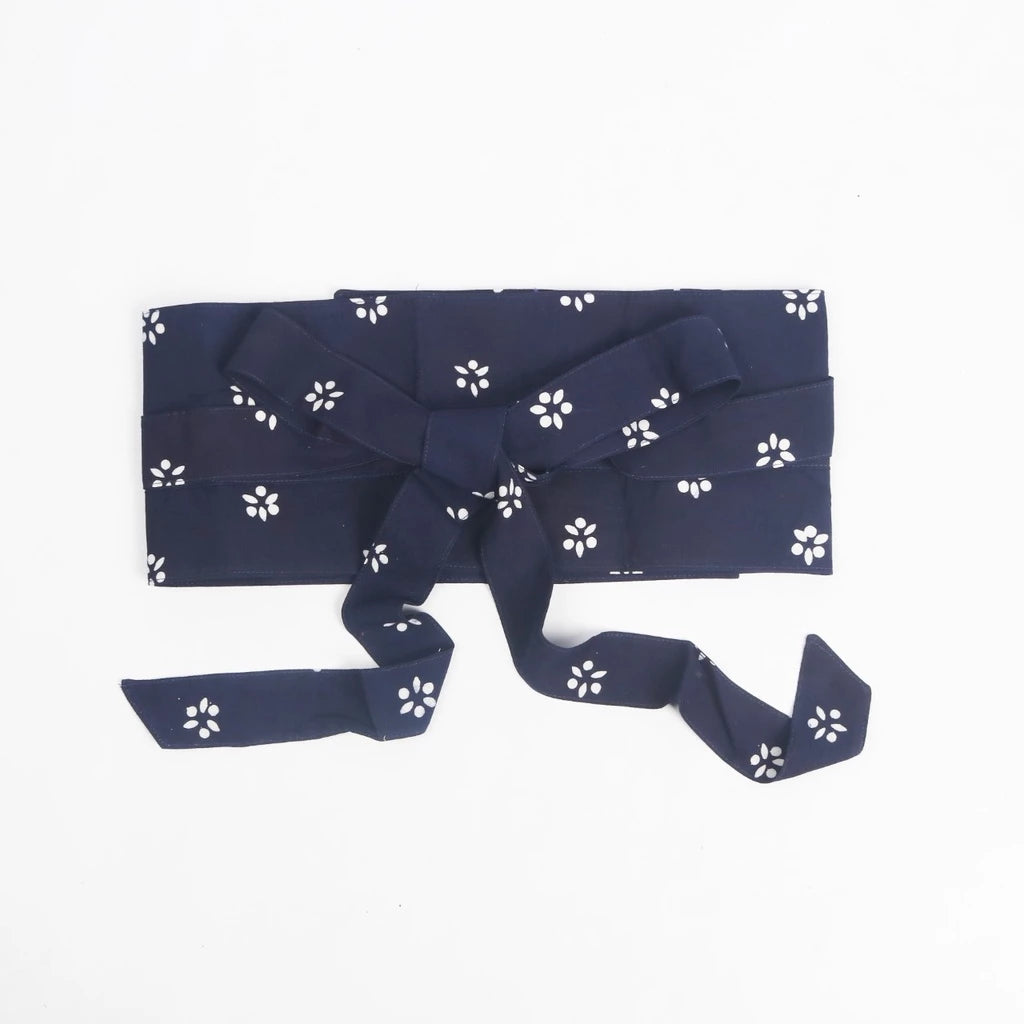 A navy obi belt with white floral pattern, made of rayon, displayed on a white background.