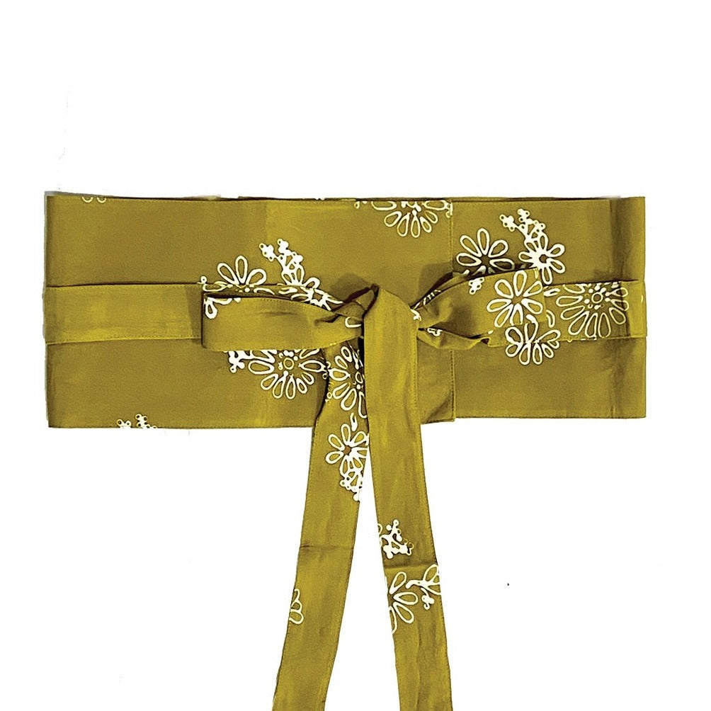 A traditional olive Obi Belt with a floral pattern in brown, made of rayon, tied in a bow.