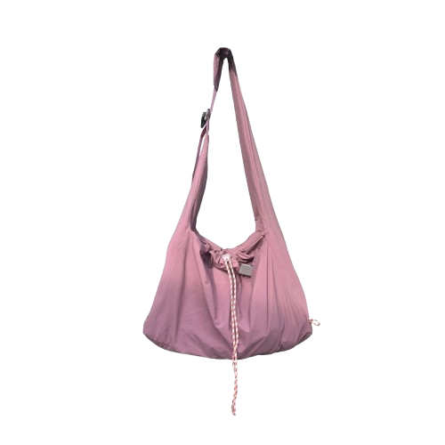 Pink shoulder bag by Measure Pleasure with drawstring on a white background