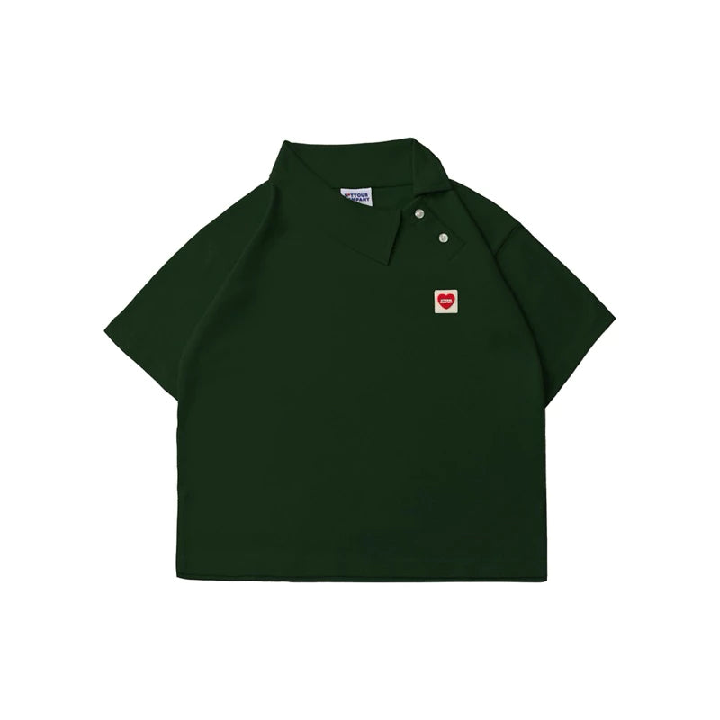 Dark green polo shirt with a small red heart logo by notyourcompany on a white background