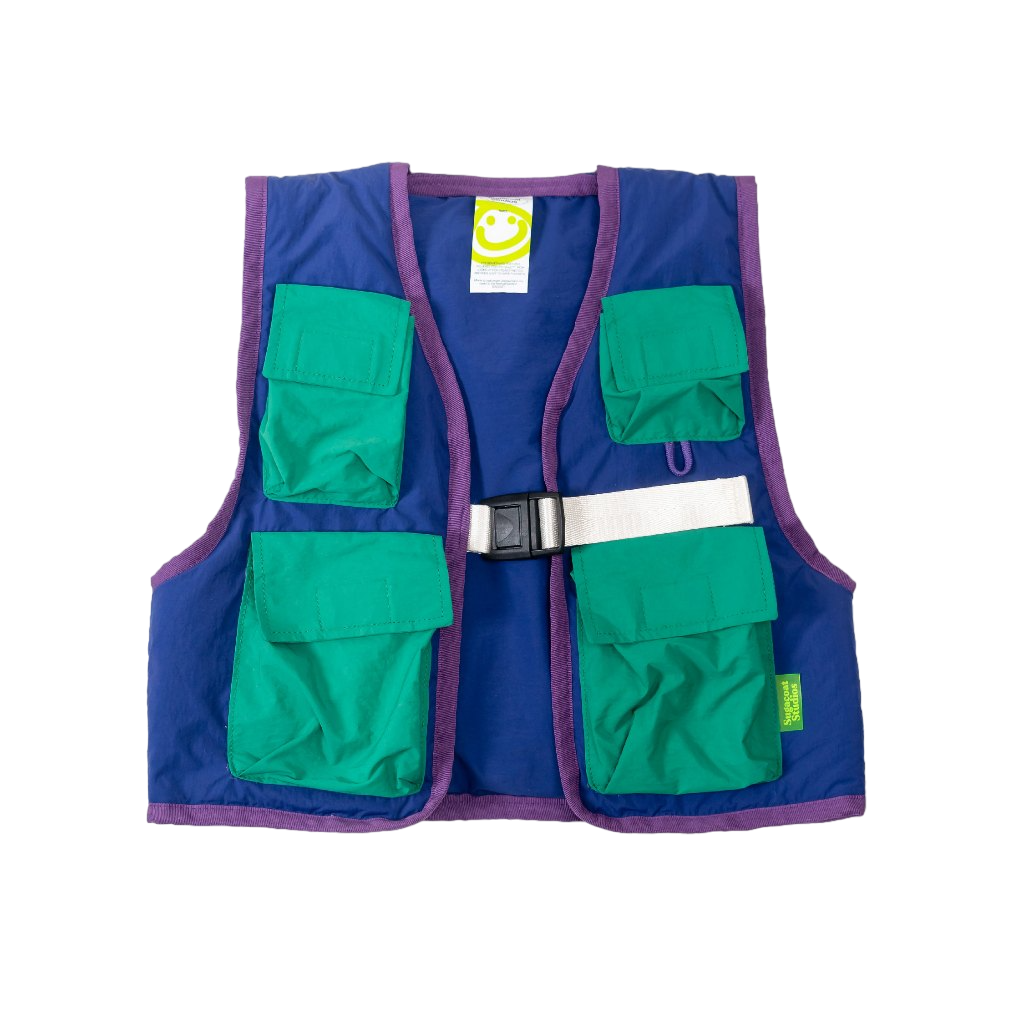 A blue field vest with multiple green pockets and a visible brand tag, designed for children.