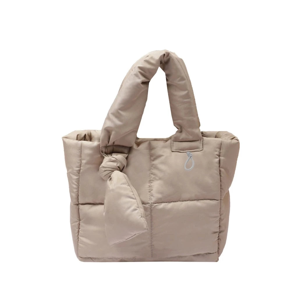 A beige nylon handbag by Hunting Fields.
