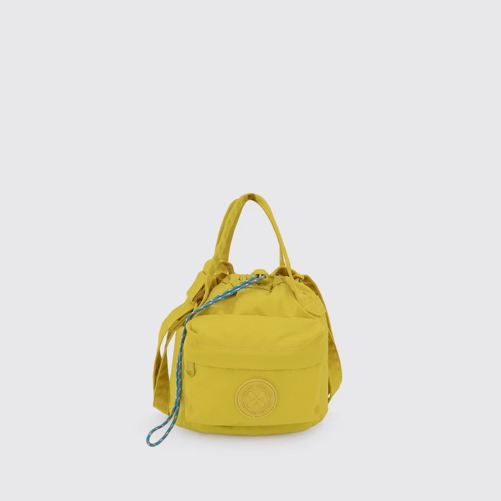 Yellow drawstring bag by Exsport Bag on a light gray background