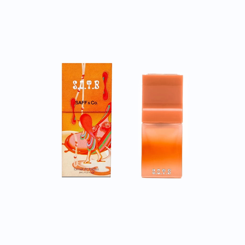 SAFF & Co. Extrait de Parfum S.O.T.B 8ml in a gradient orange bottle with bold rectangular cap, displayed next to its illustrated box featuring surreal abstract art.