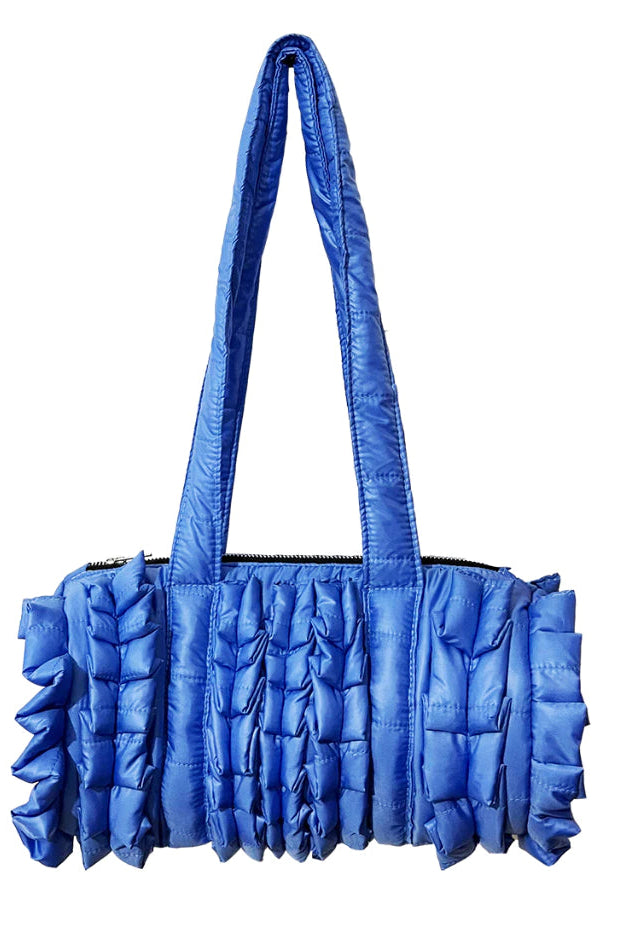 Blue ruffled duffle bag by Mannequin Plastic on a white background