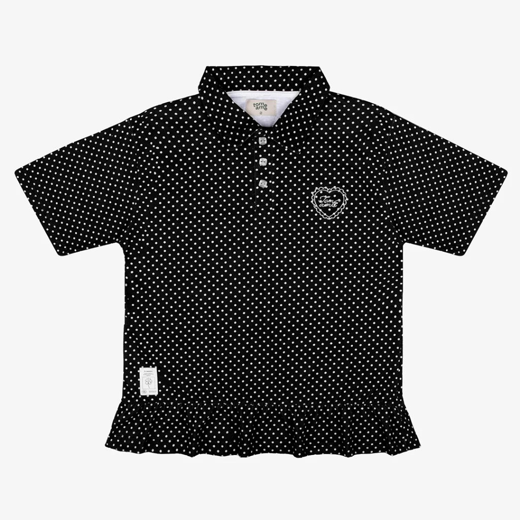 Black polo shirt by Tome Ame with white polka dot pattern on a white background