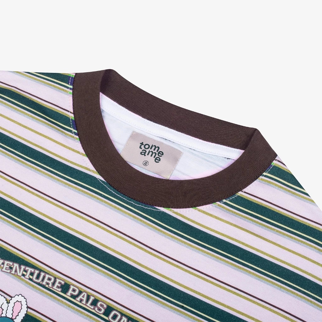 Close-up of a Tomerebi t-shirt with a visible brand label on a white background