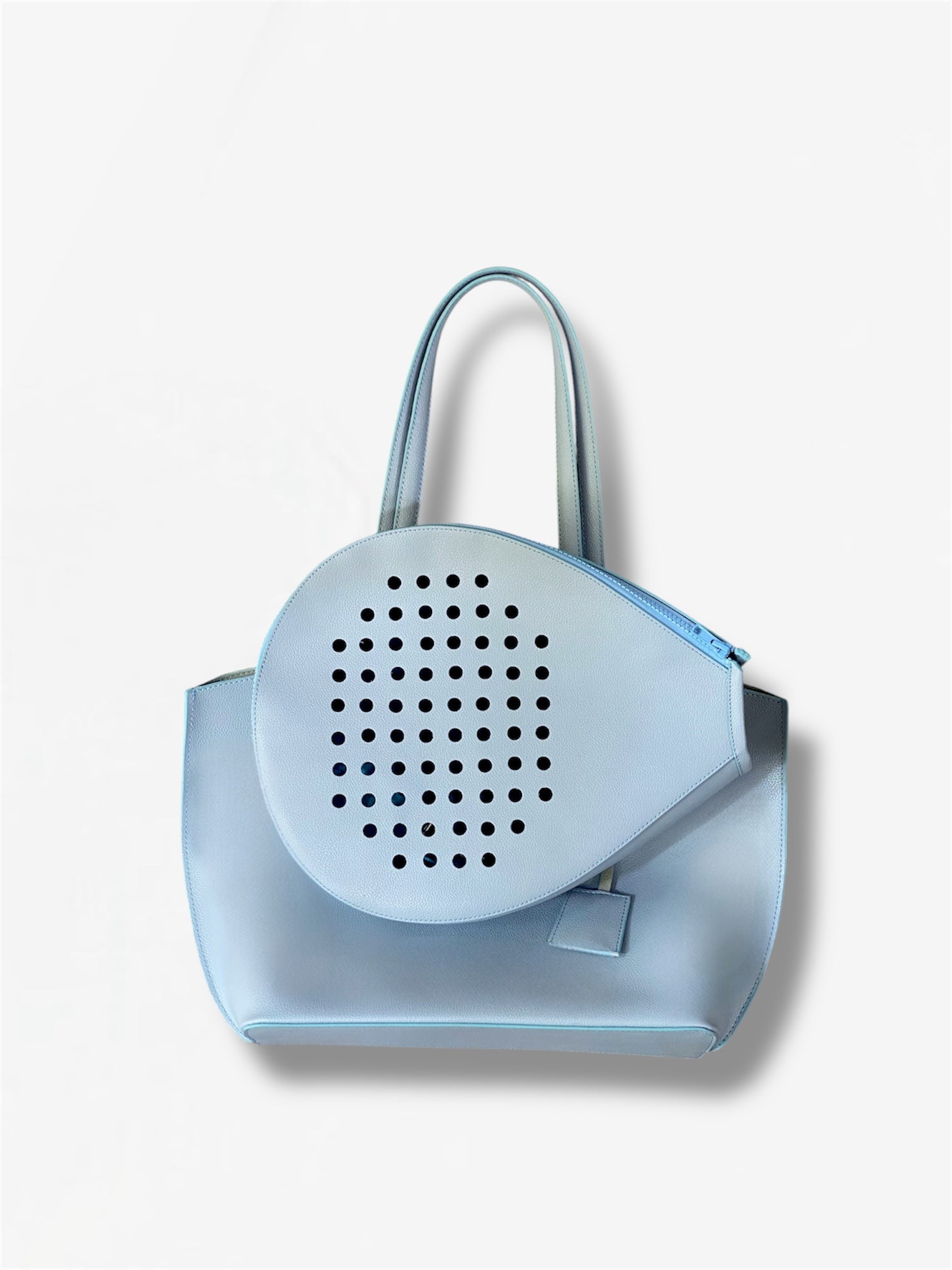 Light blue designer tote bag from Masagi with padel racket carrier, dual handles, and modern minimalist style.