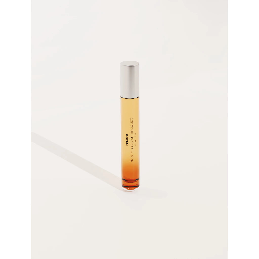 A travel size of White Floral Bouquet perfume bottle from Scents Of Pluto.