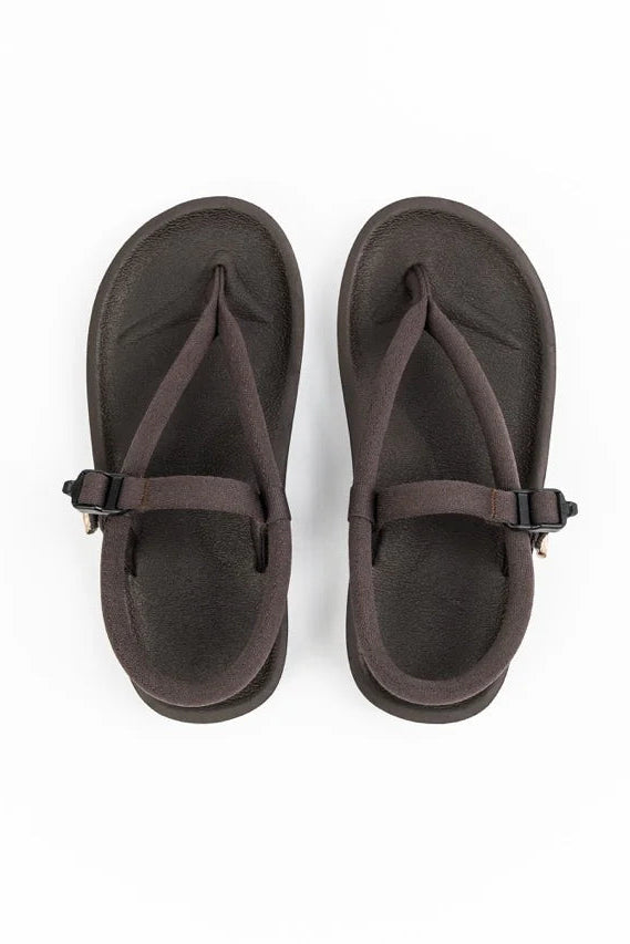 Pair of brown sandals by Gahalu on a white background