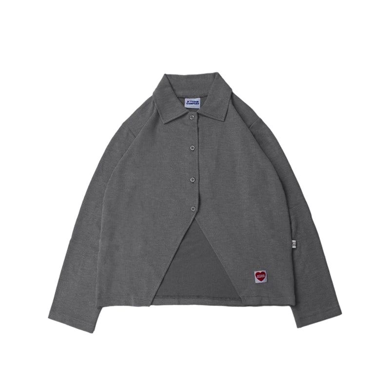 Black shirt with a small red heart logo by notyourcompany on a white background